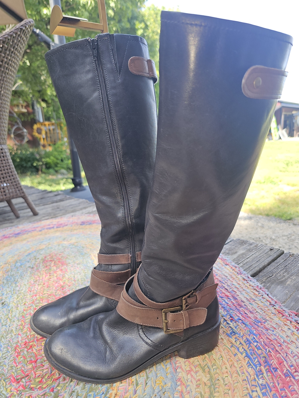 Black Leather Knee-High Riding Boots with Brown Strap Detail
